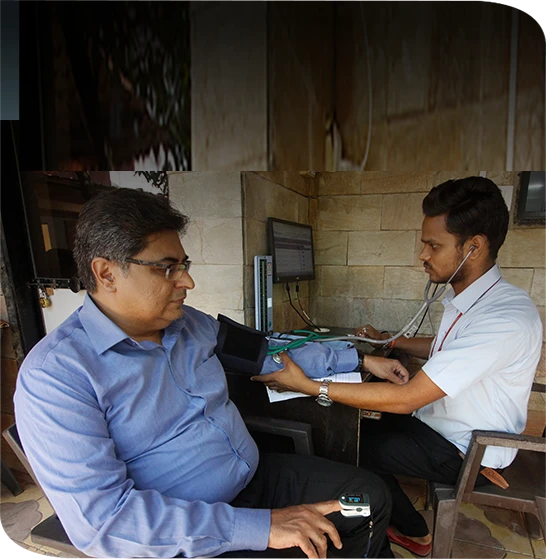 Ayurvedic doctor doing treatment at Madhavbaug clinic